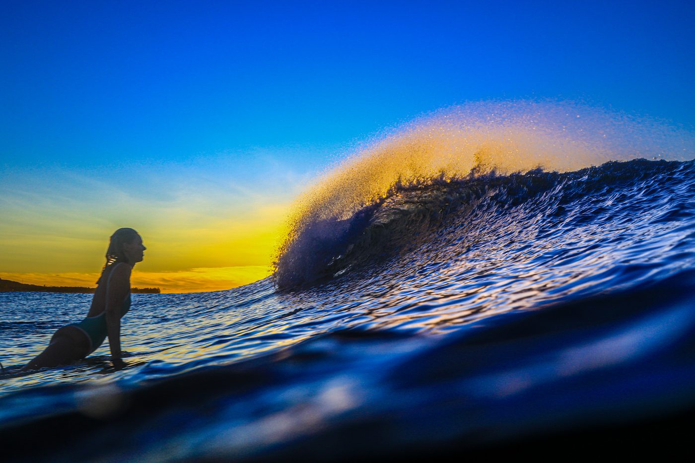 Beginner surfer receiving personalized instruction during a Learn to Surf lesson