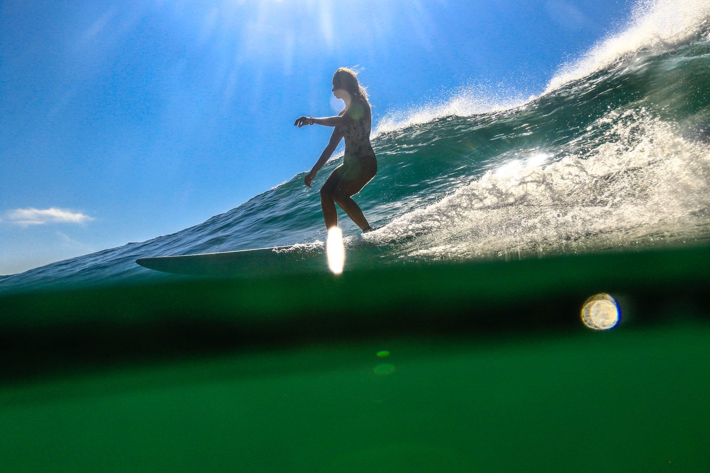 Longboard coach demonstrating cross-stepping and nose riding technique
